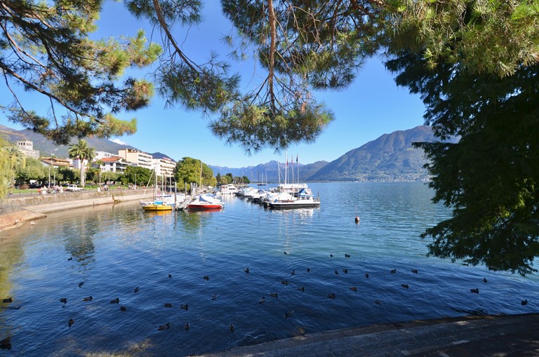 Locarno Region, Locarno lake shore view with boats, Lake Maggiore view, Ticino, Switzerland 