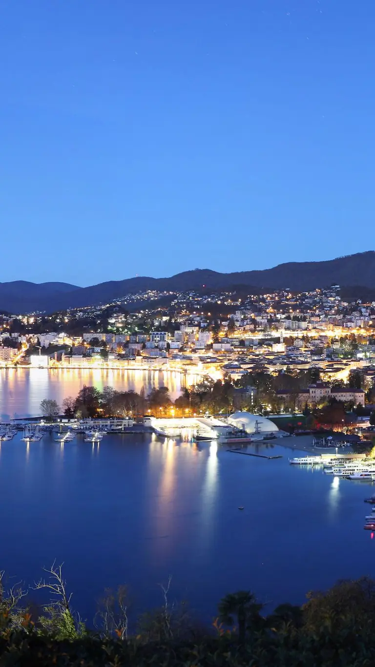 Lugano city by night at Lake Lugano, Ticino, Switzerland